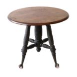 A Mahogany Circular-Top Occasional Table, on a later ebonised and spiral turned base with metal cast