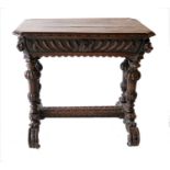 A Victorian Carved Oak Library Table, 3rd quarter 19th century, the canted rectangular moulded top
