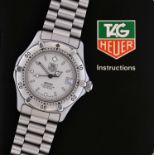 Tag Heuer: A Stainless Steel Calendar Centre Seconds Wristwatch, signed Tag Heuer, Professional