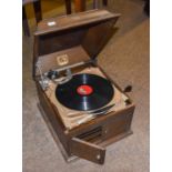 An HMV (His Master's Voice) Model 103 Gramophone, in an oak case with records.