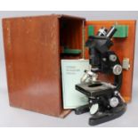 A Cooke Troughton & Simms Binocular Microscope, in fitted wood case with accessoriesAll parts move