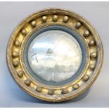 A Regency Gilt Framed Convex Mirror, with gilt slip, 36cm diameterFrom the Estate of Stephen