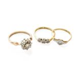 A 9 Carat Gold Cubic Zirconia Cluster Ring, finger size S; A Diamond Three Stone Ring, stamped '