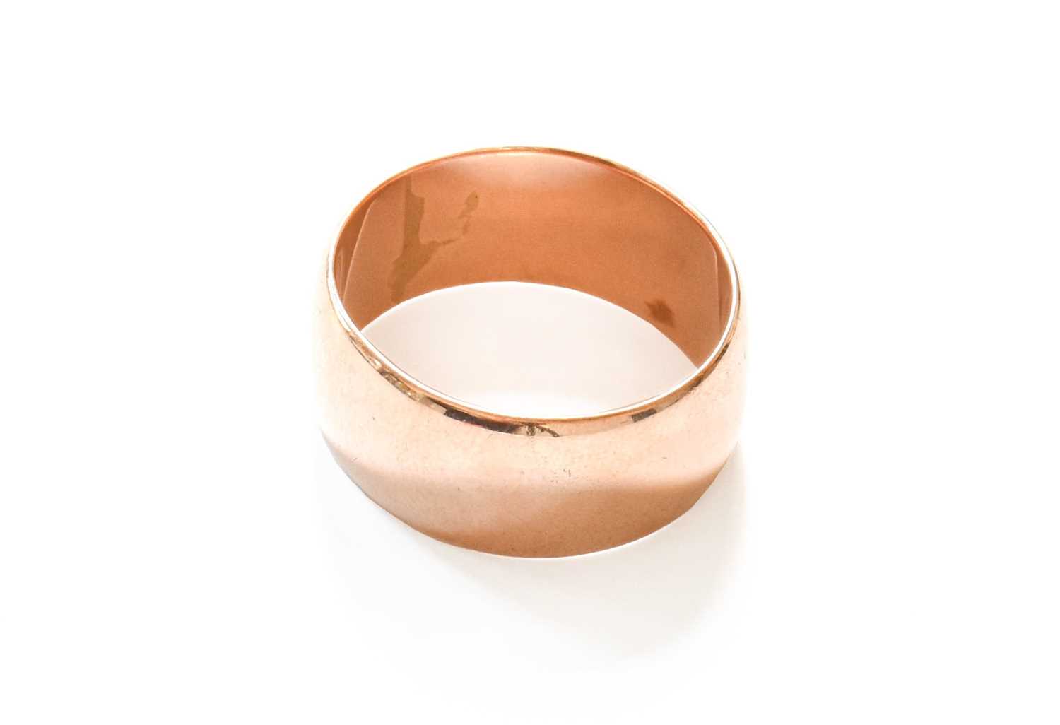 A 9 Carat Gold Band Ring, finger size USlightly misshapen. Gross weight 10.1 grams.