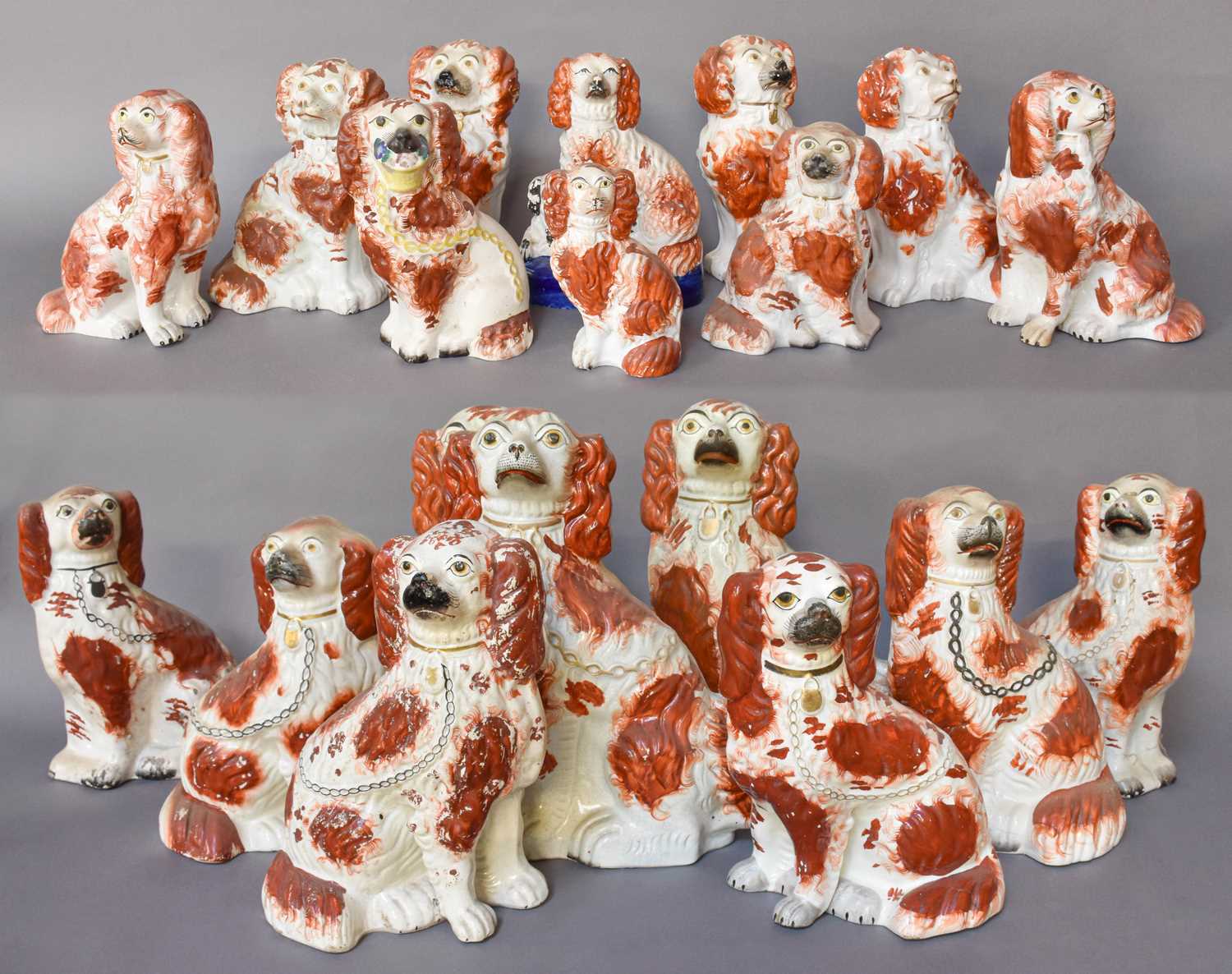 A Collection of 19th Century Staffordshire Seated Spaniels, all red and white glazed including and