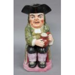 An Early 19th Century Pearlware Toby Jug, decorated in coloured enamels, 25cm highFrom the Estate of
