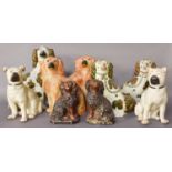 A Small Group of Staffordshire Dogs, including copper lustre examples, a pair of pugs and others,
