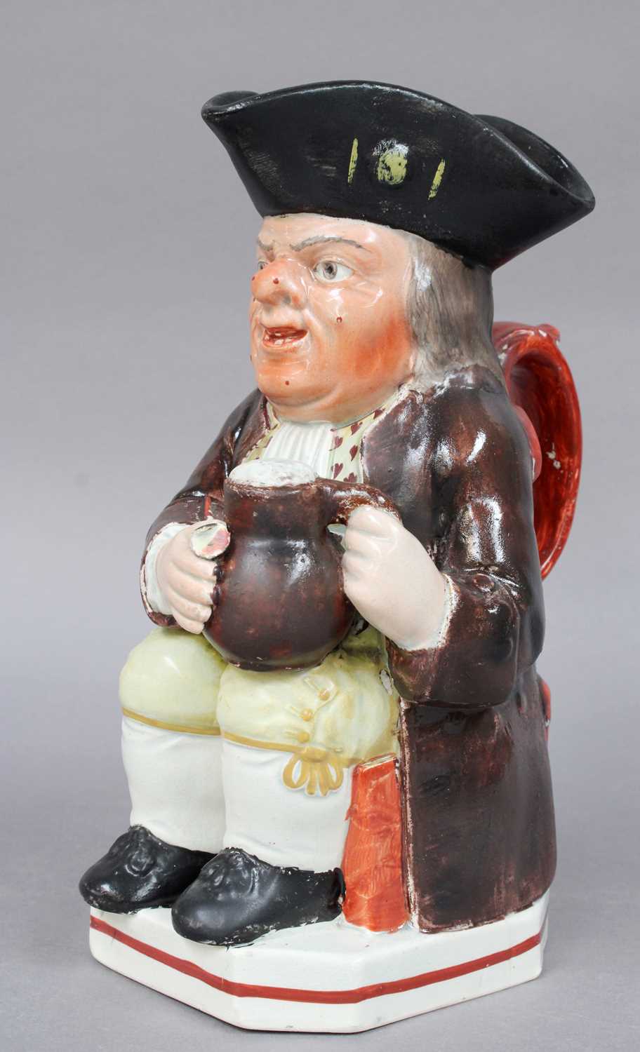 A 19th Century Pearlware Toby Jug, of Wood type, painted in enamels, 24cm highFrom the Estate of