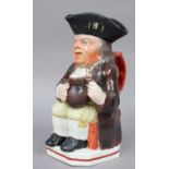 A 19th Century Pearlware Toby Jug, of Wood type, painted in enamels, 24cm highFrom the Estate of
