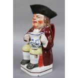 An Early 19th Century Pearlware Toby Jug, by John Walton, painted in enamels, script mark to base,