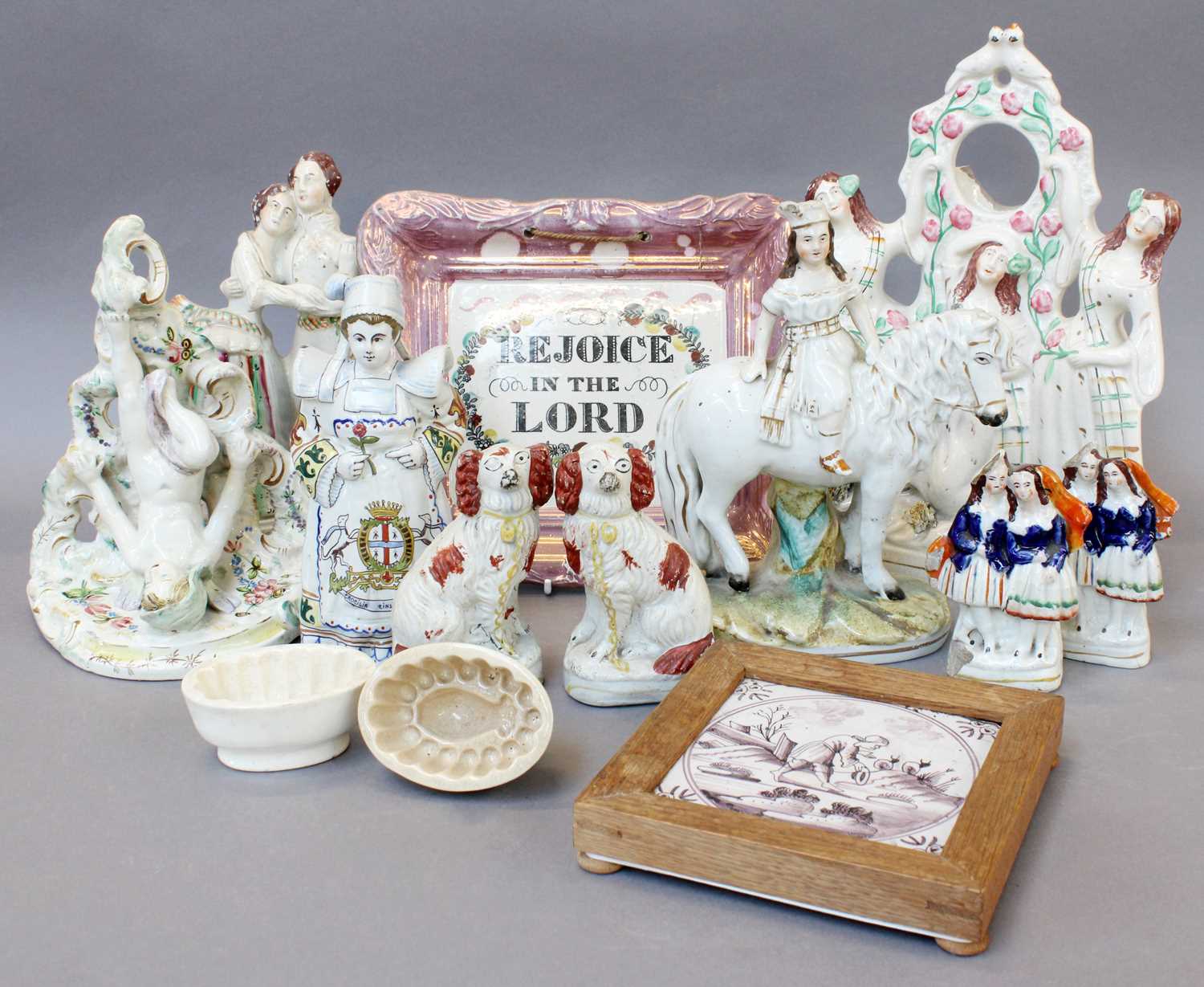 A Tray of Victorian Staffordshire Pottery, including a pocket watch stand modelled as the three