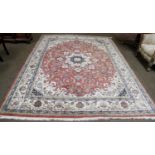 An Indian Carpet, the field of vines centred by a medallion framed by spandrels and ivory borders,