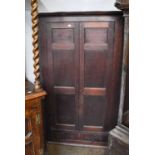 A George III Large Oak Hanging Corner Cupboard, with panelled doors and fitted with three short