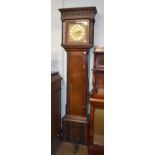 An Oak Thirty-Hour Longcase Clock, the 10" square brass dial bearing an inscription to the centre