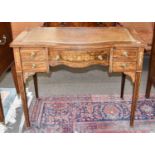 An Edwardian Inlaid Rosewood Bowfront Writing Table, with leather inset top, on square tapering
