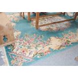 A 'Savonnerie' Design Carpet, the jade floral field centred by a medallion, 370cm by 272cm