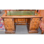 A Victorian Figured Walnut Desk At least five replacement handles. The leatherwork needs