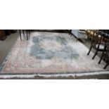 A Chinese 'Savonnerie' Carpet, the field with central floral panel enclosed by ivory borders,