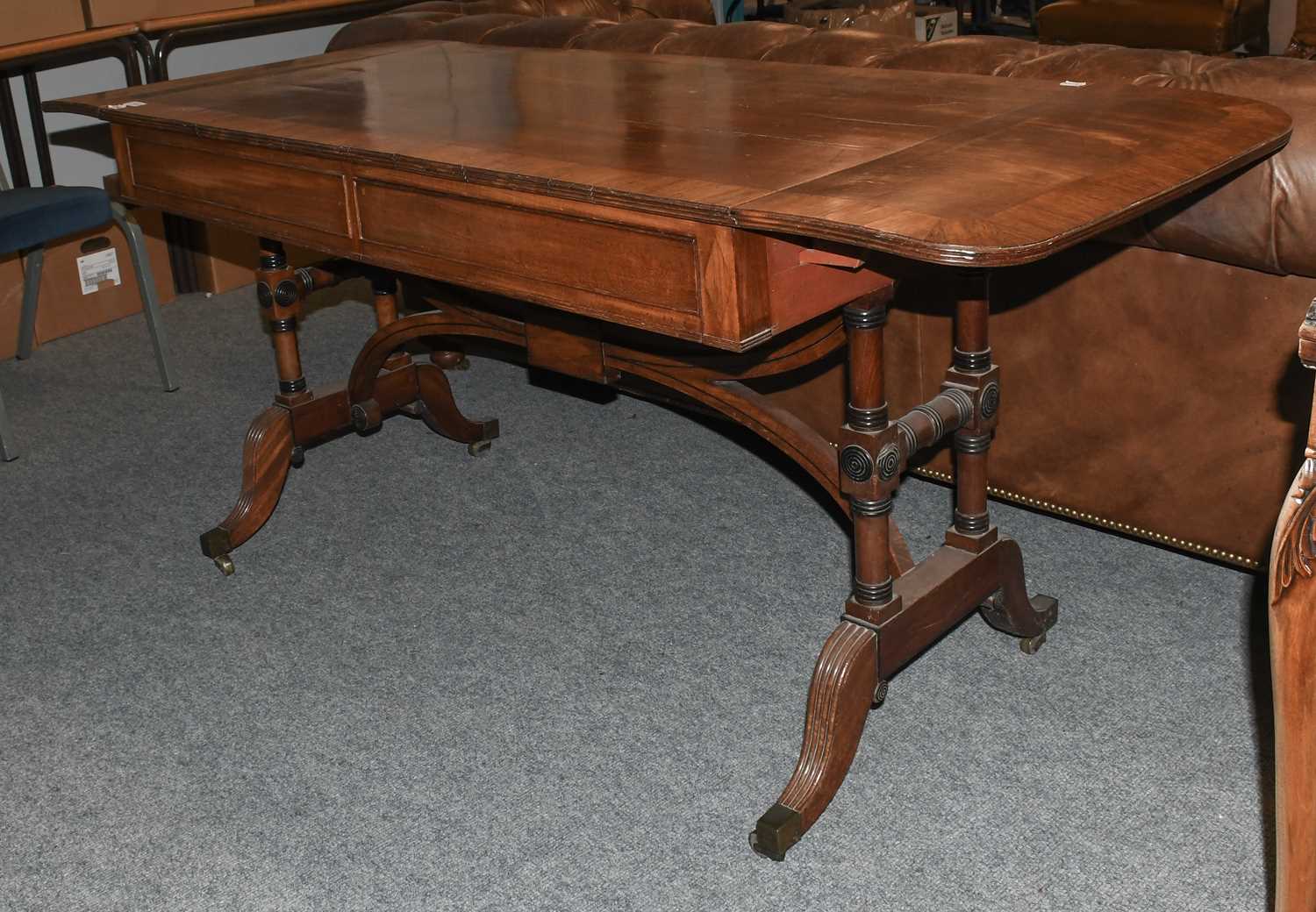 A George IV Mahogany Sofa Table, with two D-shaped flaps to the rectangular top and with two