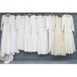 Circa 1930-60s Wedding Dresses, comprising a cream crepe long sleeve dress with V-neck and pleated