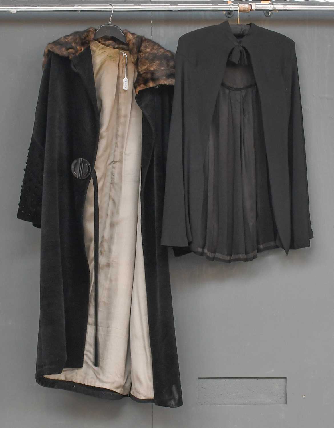 Circa 1920s Black Evening Coat of textured design with diagonal self woven stripes, long flared