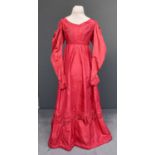 Early 19th Century Cerise Silk Dress, with military style multi pleated panels to the bodice, empire