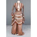 Circa 1870 Brown Fine Striped Bustle Back Silk Dress with long sleeves, faux buttons to the