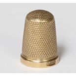 A 9ct Gold Thimble, London, with engine-turned finish, 4.7gr