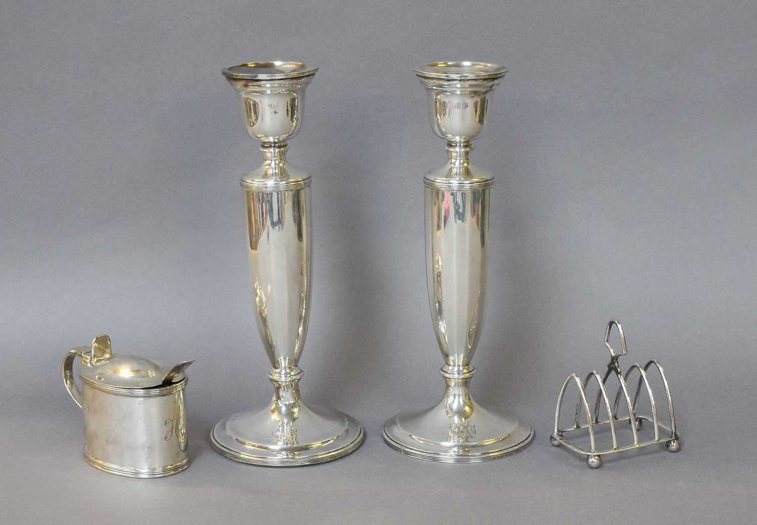 A Collection of Assorted Silver, comprising a pair of candlesticks, filled, 21.5cm high; a George IV