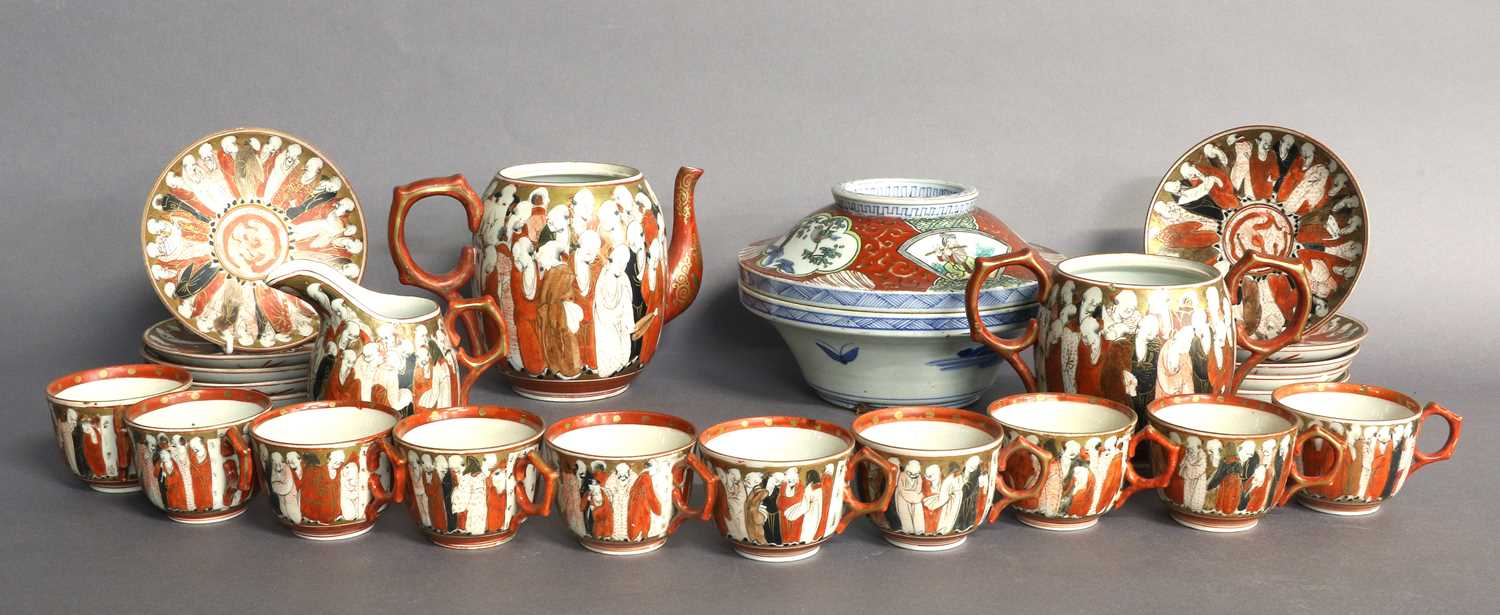 A Kutani Porcelain Tea Service, Meiji period, decorated with figures, comprising teapot, sucrier,