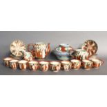 A Kutani Porcelain Tea Service, Meiji period, decorated with figures, comprising teapot, sucrier,