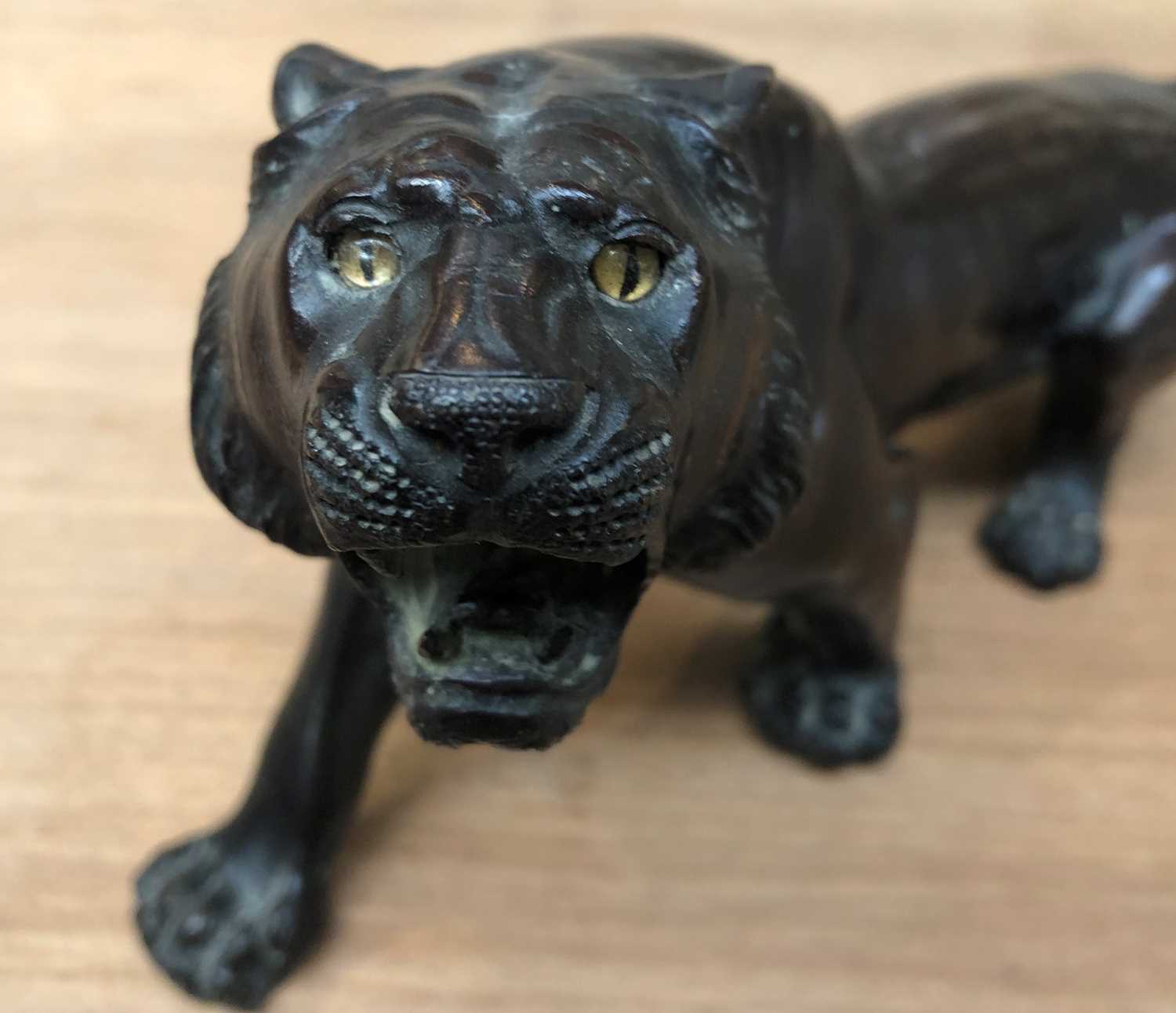 A Japanese Meiji Period Bronze Figure of a Stalking Tiger, on a wooden plinth, 32cm long Missing one - Image 7 of 7