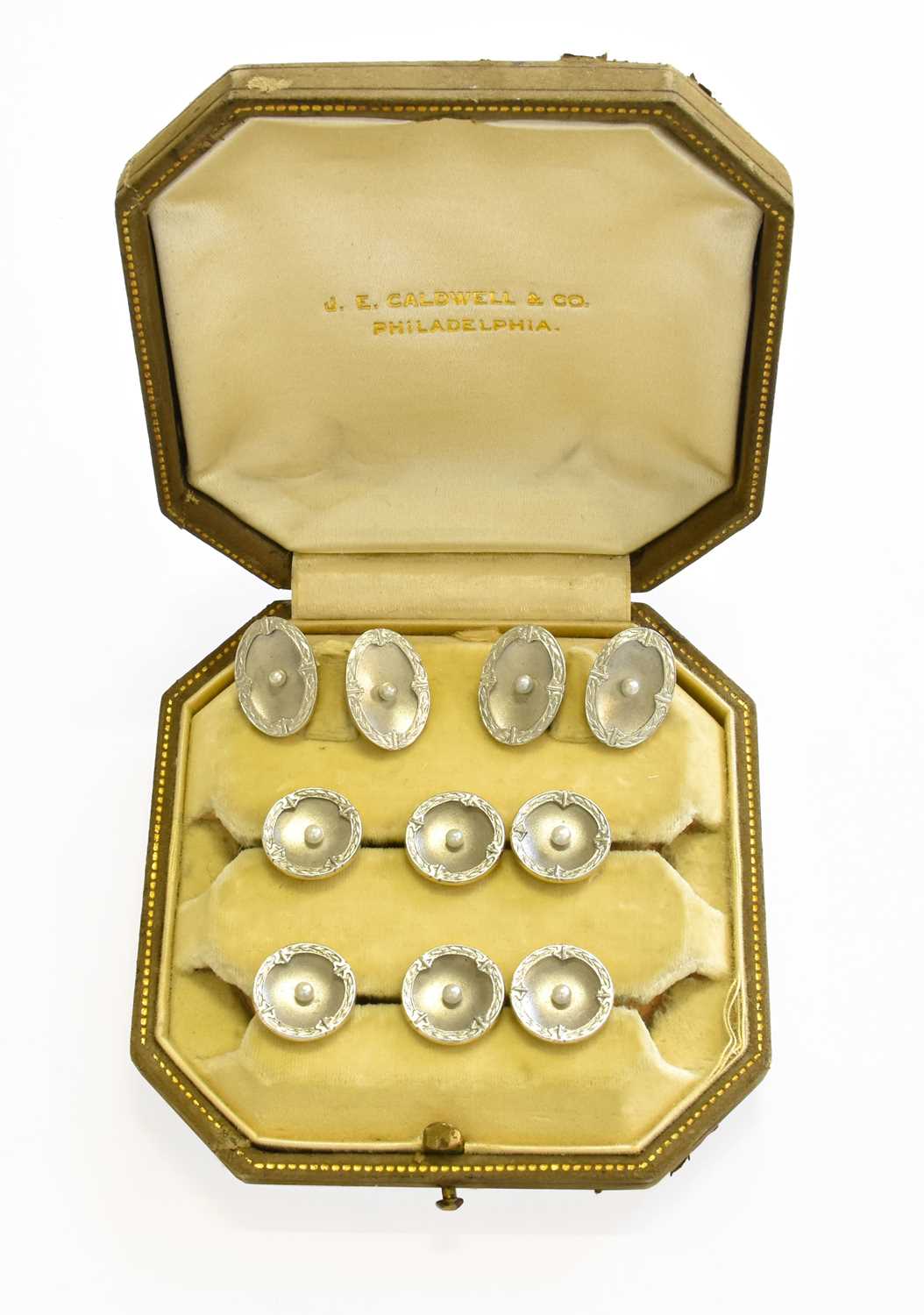 A Pair of Cultured Pearl Cufflinks and Six Buttons, casedStamped '14'/'14KT', in our opinion would