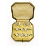 A Pair of Cultured Pearl Cufflinks and Six Buttons, casedStamped '14'/'14KT', in our opinion would