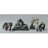 A Pair of Bronzed Spelter Figures of Elephants (remove ivory tusks), a resin figure of a Recumbent