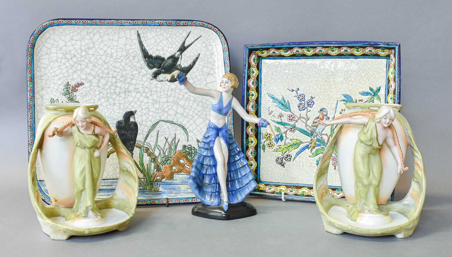 A Continental Porcelain Art Deco Figure of a Dancing Girl, two similar Austrian figural vases and