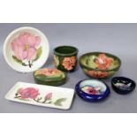 A Collection of Moorcroft Pottery, comprising two Orchid pattern dishes, a green ground Coral