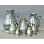 Seven Pewter Haystack Measures including; gallon, half gallon, quart pint, half pint and half