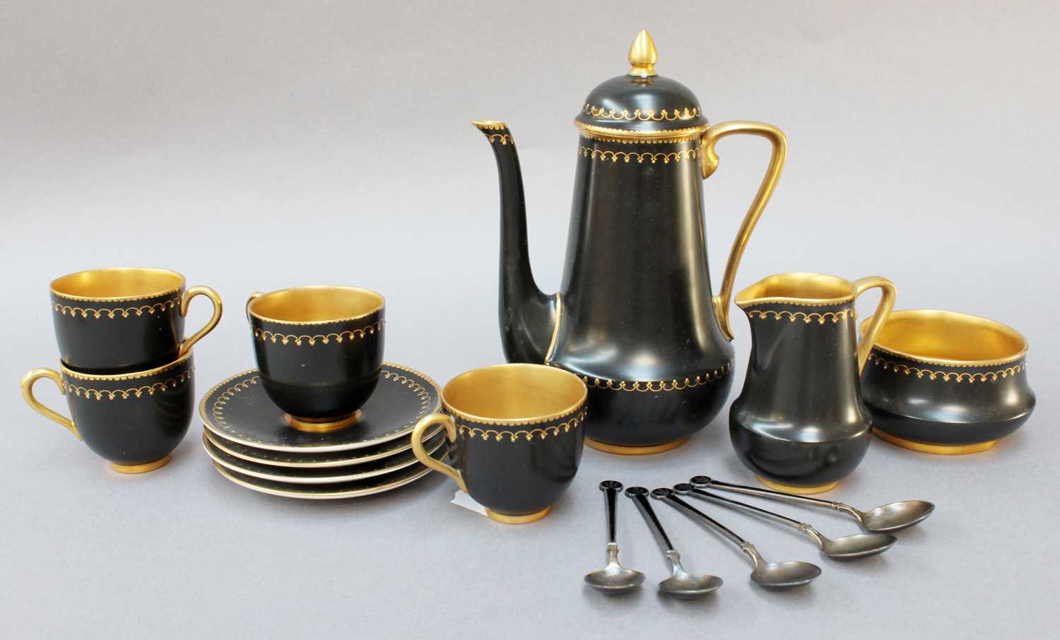 A Royal Worcester Part Coffee Service, black ground and gilt, together with a set of five silver and