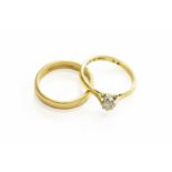 A 9 Carat Gold Band Ring, finger size M; and A Diamond Solitaire Ring, stamped '18CT' and 'PLAT',