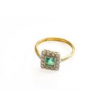 An Emerald and Diamond Cluster Ring, the square step cut emerald within a border of eight-cut