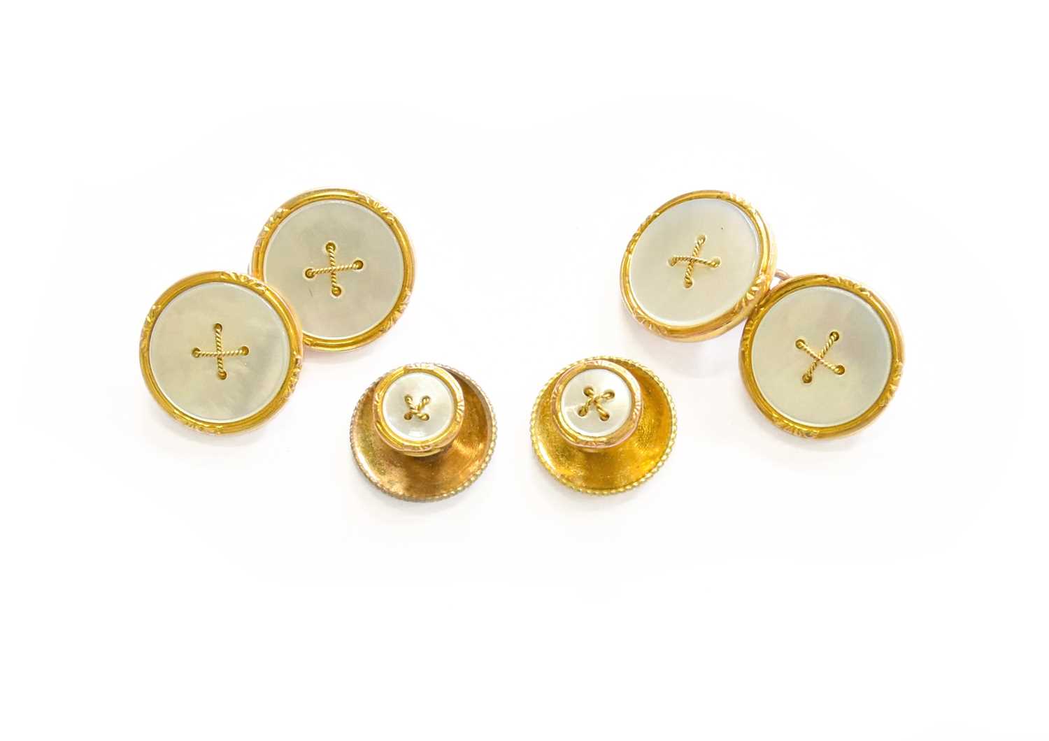 A Mother-of-Pearl Cufflinks and Two Dress Studs, the circular mother-of-pearl plaques with a