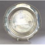 A George V Silver Dish, by George Howson, Sheffield, 1931, shaped circular, the broad rim with