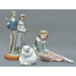 A Lladro Figure Group of Golfers, 36cm high; together with a Nao figure of a girl and a Berlin