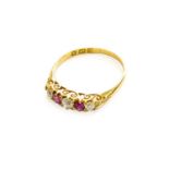 An 18 Carat Gold Ruby and Diamond Five Stone Ring, finger size PThe ring is in good condition. It is