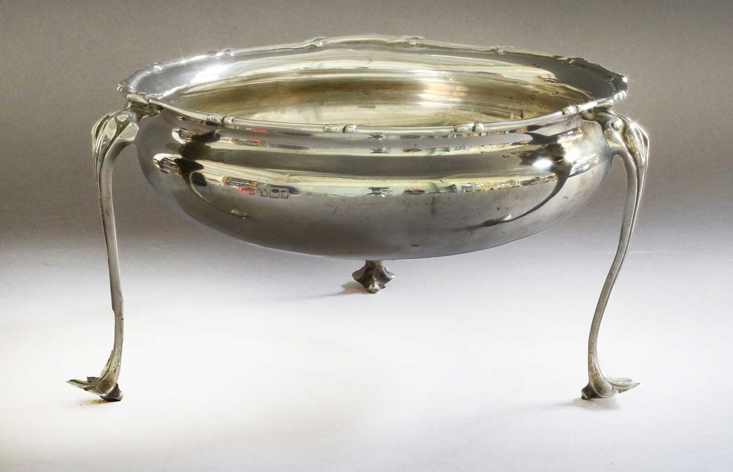 An Edward VII Silver Bowl, Maker's Mark Rubbed, Sheffield, 1906, circular and on three Art Nouveau