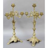 A Pair of Gilt Brass Four Light Candelabra, on stylised leaf moulded bases; together with a