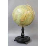 A Philip's 12 inch Terrestrial Globe, turned ebonised plinth, with scroll feet, 56cm high;