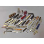 A Collection of Thirty Six Various Folding Pocket Knives, including a Military issue example with