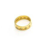 An 18 Carat Gold Diamond Ring, the round brilliant cut diamonds in yellow star settings, total